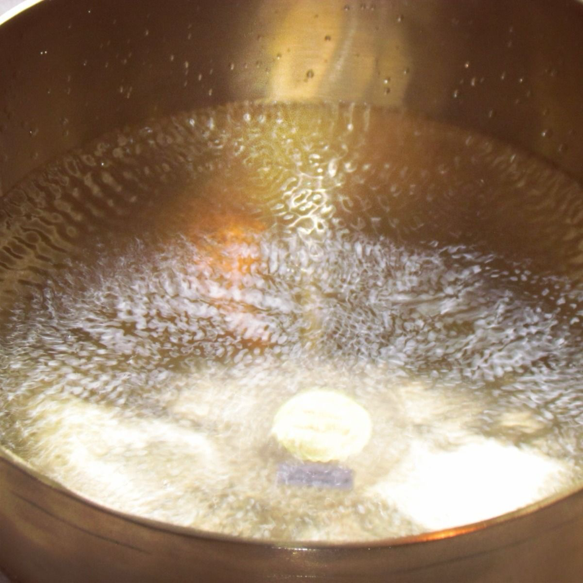 water vibrating inside a quartz singing bowl